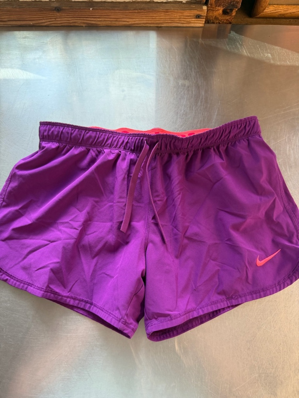 Nike Women’s Purple Athletic Shorts with Pink Swoosh